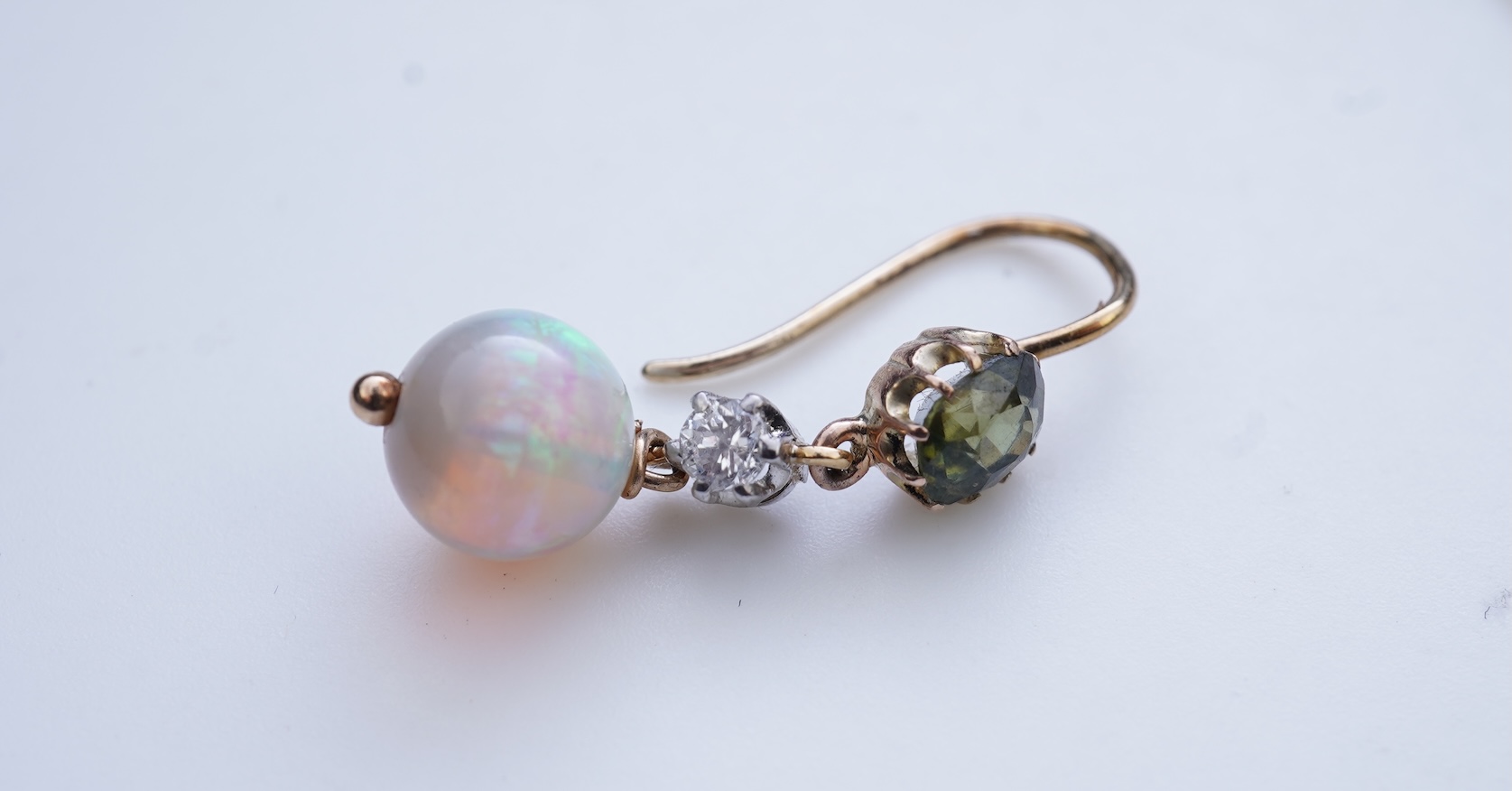 A pair of opal, green zircon and diamond earrings
